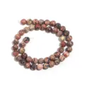 Detail van natuurstenen ronde kralen streng, ideaal voor het maken van DIY sieraden en armbanden. - Rode Luipaardhuid Ronde Kralen Streng (Artikel: T5036) / 8mm (ongeveer 45 stuks)
