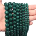 Detail shot of dark green gemstone loose round beads, perfect for DIY jewelry making and crafting. - Chalcedony / 10mm (Approx 35pcs) / Dark Green