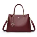Elegant burgundy women leather handbag stylish top handle shoulder bag with heart charms - Ancorra Red