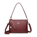 Burgundy leather shoulder bag for women, stylish underarm crossbody bag with textured finish. - Burgundy