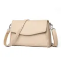 Beige minimalist crossbody bag for women, stylish leather messenger bag with flap and metal parts. - Shell Apricot