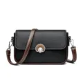 Stylish women's black and brown leather crossbody bag with chic metallic lock closure. - Black