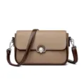 Stylish women's leather crossbody bag with chic turn-lock closure and adjustable strap. - Khaki