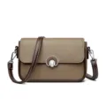 Stylish women's brown leather crossbody shoulder bag with dark brown strap and metal twist lock. - Brown