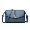 Blue leather shoulder bag for women, elegant crossbody purse with chic metal clasp and strap. - Blue