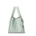 Detail view of the mint green leather handbag, soft touch, dual handles and clover charm. - With Pendant / Sky Blue