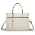 Stylish women's quilted tote bag in elegant beige leather with top handles and chain charm. - Off White