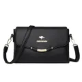 Black PU leather women's shoulder crossbody bag with elegant gold hardware and strap. - Black