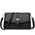 Stylish black leather crossbody shoulder bag for women with elegant gold hardware and flap. - Black