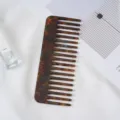 Tortoiseshell wide tooth acetate hair comb detail shot showing texture and smooth polished finish. - 17# 11.8x4.6cm Brown Acetate Hair Comb