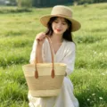 Detailed close-up view of woven straw tote bag and matching stylish summer hat outdoors. - Bag And Hat Set / Beige Khaki Striped