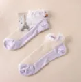 Sheer crystal silk ankle socks with delicate lace ruffle trim and purple cotton sole. - One Size / Purple