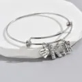 Adjustable silver wire bangle bracelet with rhinestone letter K, butterfly and heart charms. - Style K