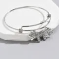 Adjustable silver tone charm bracelet featuring letter M, butterfly and heart pendants. - Pattern M