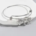 Adjustable silver tone wire bangle bracelet featuring rhinestone letter T heart butterfly charms. - Pattern T