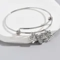 Adjustable silver bangle bracelet featuring rhinestone letter V charm, heart and butterfly. - Style V