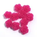 Close-up detail of hot pink 3D resin camellia flower charms, ideal for DIY jewelry and cases. - Rose Red