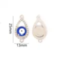 Evil eye charm detail view, rhinestone teardrop alloy pendant showing front and back structure. - Silver Teardrop Bracelet