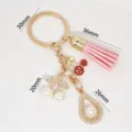 Gold alloy keychain with pink tassel, pearl cherry and rhinestone charms, size 30-36mm. - Pink (XH60418)
