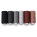 Detailed view of colorful polyester sewing threads in neat spools, ideal for DIY crafts. - 400 Yards/Roll / Black Series Mixed
