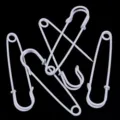 Close-up of white safety pins, ideal for DIY crafts, clothing waist adjustment, and secure fixing. - White