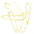 Close-up detail of light yellow safety pins, ideal for DIY jewelry, brooches, and garments. - Yellow