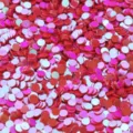 Primo piano di paillettes rotonde in PVC senza foro da 3,0 mm con finitura iridescente. - 30g/Confezione / Rosso Cangiante