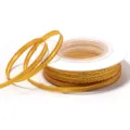 Detail view of yellow polyester gold-edged ribbon spool for gift box packaging and DIY craft. - 3mm 18m/Roll / Gold Edge Golden Yellow