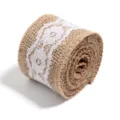 Detailed closeup of rustic jute burlap ribbon roll featuring elegant white floral lace trim for crafts. - 5cm / Size 10