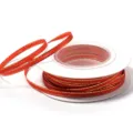 Detailed view of red gold trim polyester ribbon spool, ideal for DIY gift wrapping bows. - 3mm 18m/Roll / Red with Gold Trim