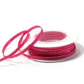 Detail shot of pink polyester ribbon with gold edge on spool for DIY gift packaging bows. - 3mm 18m/Roll / Gold Edge Barbie Pink