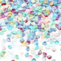 Primo piano di paillettes a conchiglia lucide e colorate, ideali per nail art e bricolage. - 30g/Confezione (8mmx6mm) / Colori Misti Galvanici