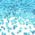 Primo piano di paillettes a conchiglia blu brillanti, perfette per nail art e accessori fai-da-te. - 30g/Confezione (8mmx6mm) / Blu Iridescente