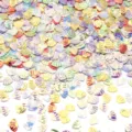 Close-up detail shot of iridescent shell shaped sequins bulk pile for nail art DIY crafts. - 30g/Pack (8mmx6mm) / Gold Lustre Mixed Colors