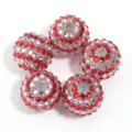 Close-up details of sparkling red and pink rhinestone resin beads for DIY craft projects. - 20mm / Red Pink