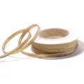 Detail shot of khaki polyester ribbon with metallic gold edge wound on a white plastic spool. - 3mm 18 Meters/Roll 25g/Roll / Light Coffee