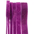 Purple glitter velvet ribbon trim detail showcasing various widths for DIY crafts and decor. - Fuschia