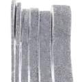 Close-up of silver glitter ribbon rolls in various widths, perfect for DIY crafts and wrapping. - Silver Gray