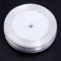 White gold edge polyester ribbon roll variant, perfect for baking and gift wrapping DIY crafts. - 0.6cm Wide/25 Yards / White