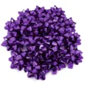 Purple metallic star ribbon bows for gift wrapping and holiday party decoration detail shot. - Purple