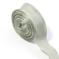 Detail view of light green polyester bubble wrinkle ribbon for gift wrapping, bows, and crafts. - Bean Green