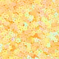 Close up detail shot of small iridescent flower sequins in yellow and orange, ideal for DIY crafts. - 30g/Pack / Iridescent Plated Yellow Small Flower