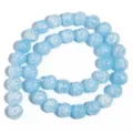 Filo di perline di cristallo crepato azzurro, perle rotonde in pietra per creazione gioielli. - Blu