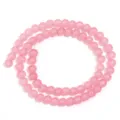 Filo di perline tonde in vetro rosa, perfetto per la creazione di bracciali e collane DIY. - Rosso anguria
