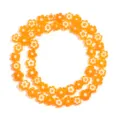 Close-up detail of orange and white flower glass beads strand for DIY jewelry making. - 8mm (Approx 54 Pieces) / Orange and White with Orange Core