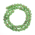 Close-up of colorful glass millefiori flower beads, perfect for DIY handmade jewelry making. - 8mm (Approx 54 Pieces) / White and Green with Red Core