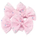Dettaglio fiocco in rete con paillettes rosa, fermaglio per capelli luminoso e accessorio. - Rosa