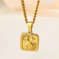 Gold stainless steel square pendant necklace with rope edge and gothic cross motif. - Letter X Necklace