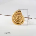 Close-up detail of the gold stainless steel seashell ring, featuring intricate textured spiral design. - Gold
