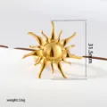 Detailed close-up of a bold gold sunburst stainless steel adjustable ring showing exact size. - Gold